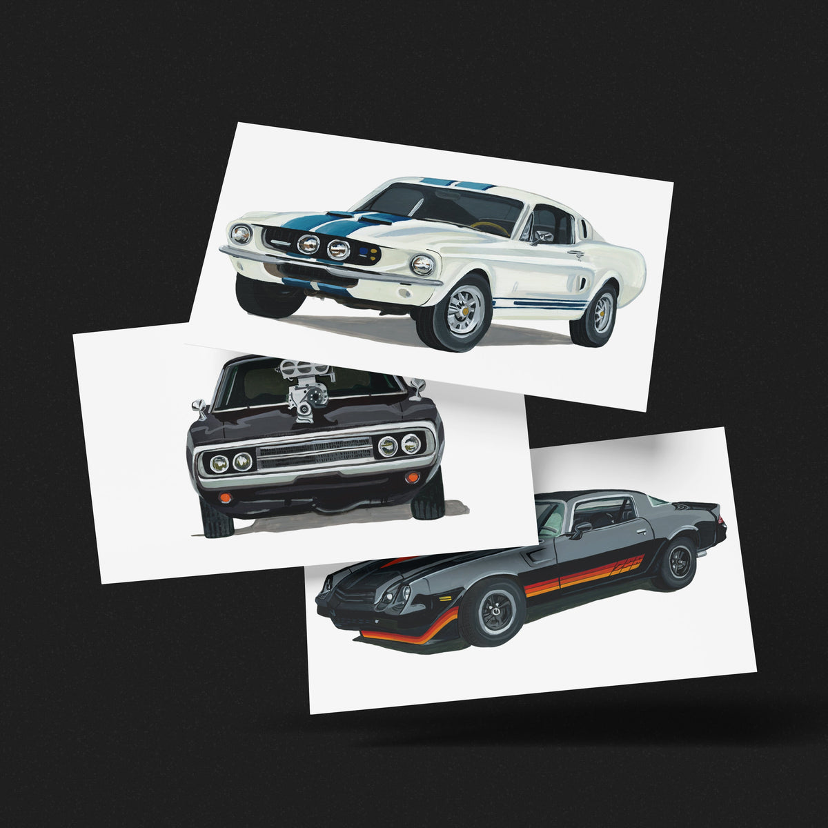 Ford Mustang GT500, Chevrolet Camaro Z28 and Dodge Charger R/T art prints fanned out on a black background
