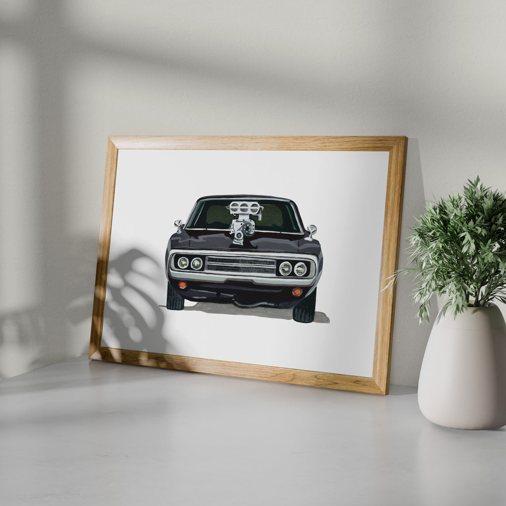 Black Dodge Charger R/T art print in a wooden frame beside a potted plant