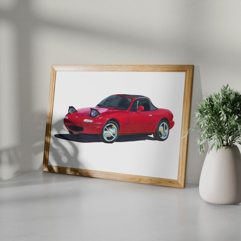 Framed red sports car art print shown at an angle on a white surface