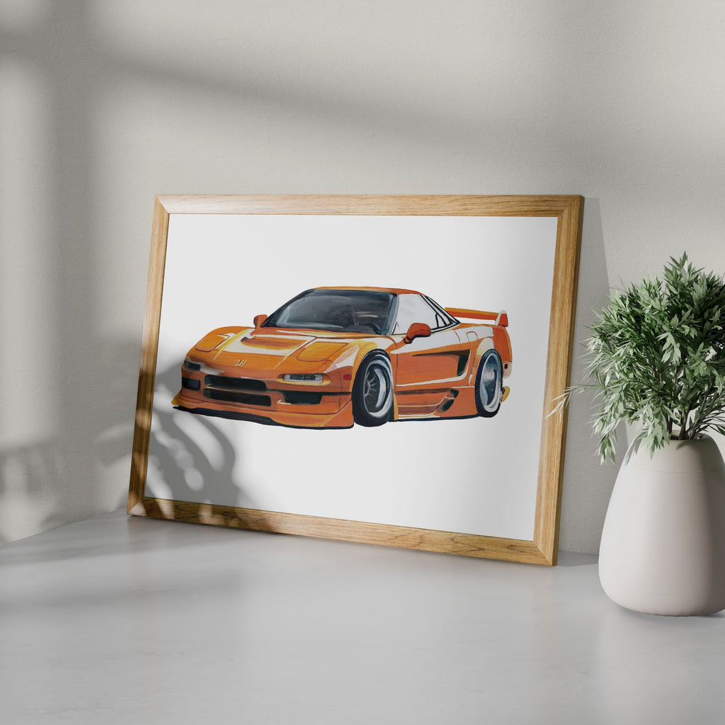 Framed orange sports car art print shown at an angle on a white surface