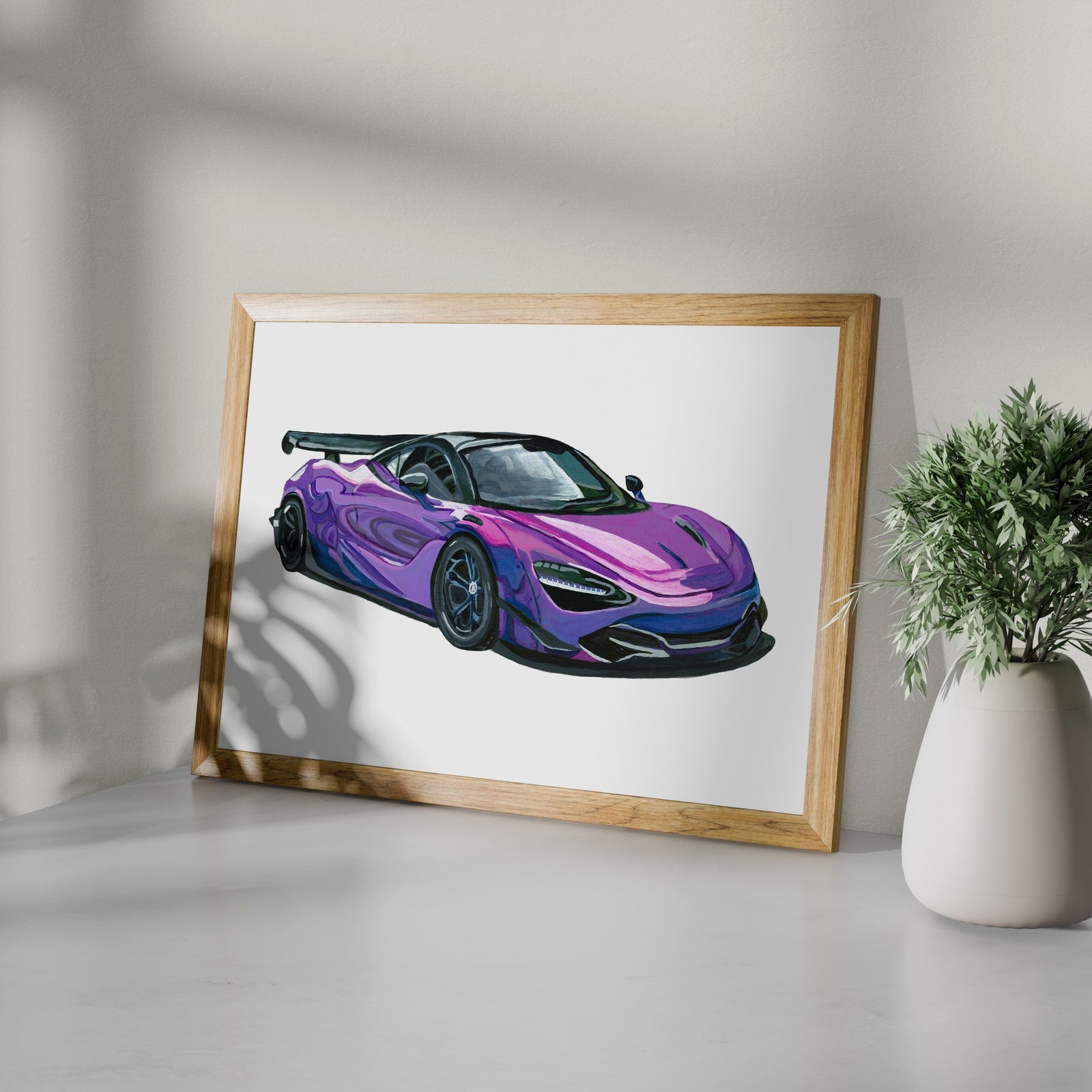 Framed purple supercar art print styled on a white shelf